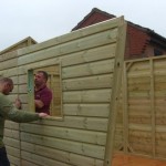 Sides being installed The Wooden Workshop Summerhouse bampton