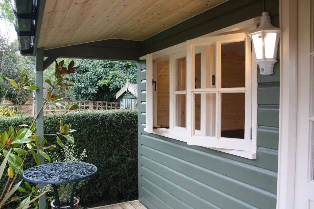 timber triple casement window all handpainted using Sadolin Superdec paint on a cedar tiled art studio