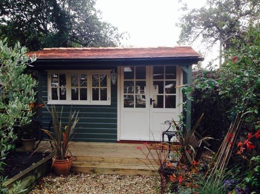 cedar tiled art studio  with French doors and roof lights