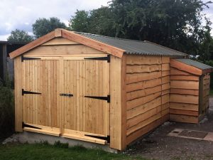 Finished Timber Garage With Log Store - The Wooden Workshop Oakford Devon