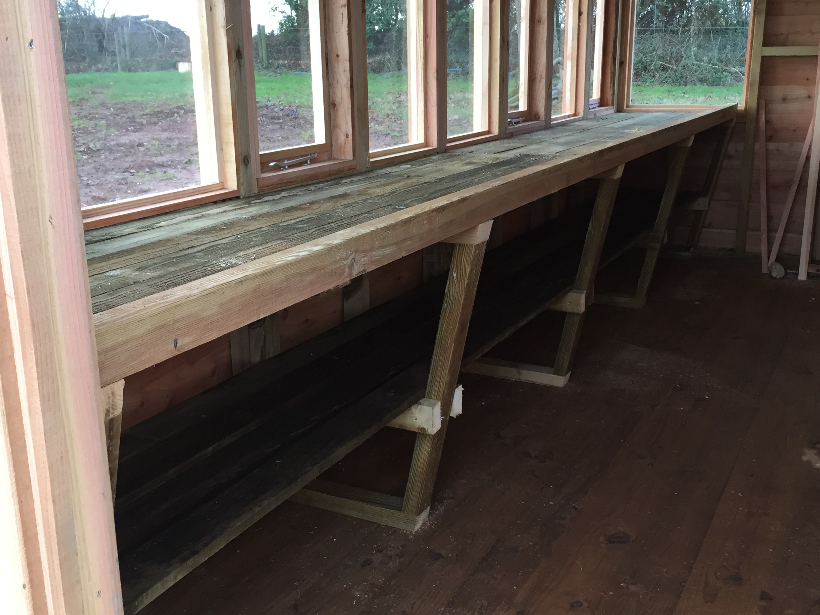 workbenches in our cedar shingle potting shed