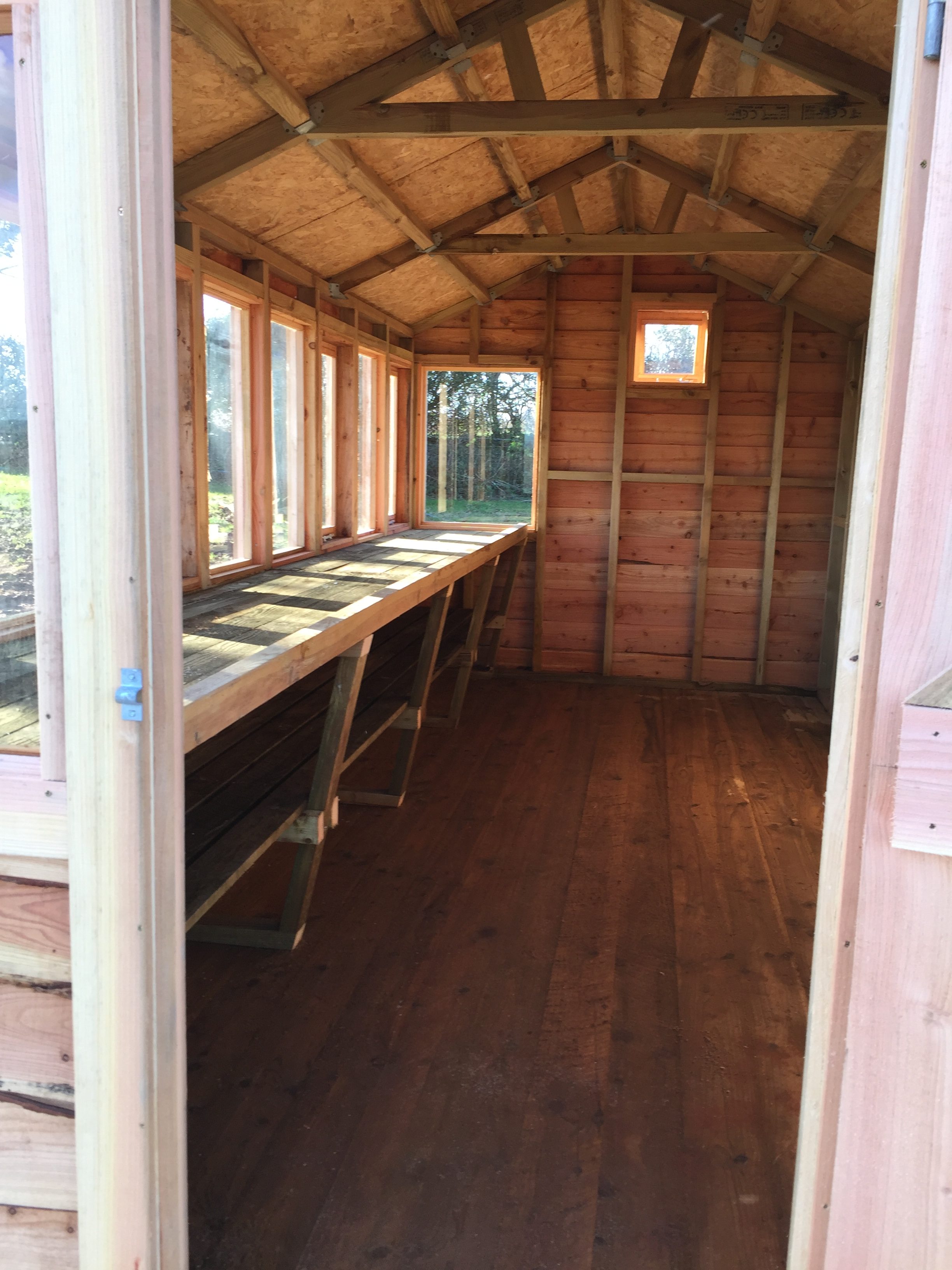 workbenches in our cedar shingle potting shed