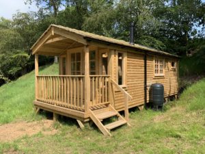 Timber Log Cabin With Wood Stove - The Wooden Workshop