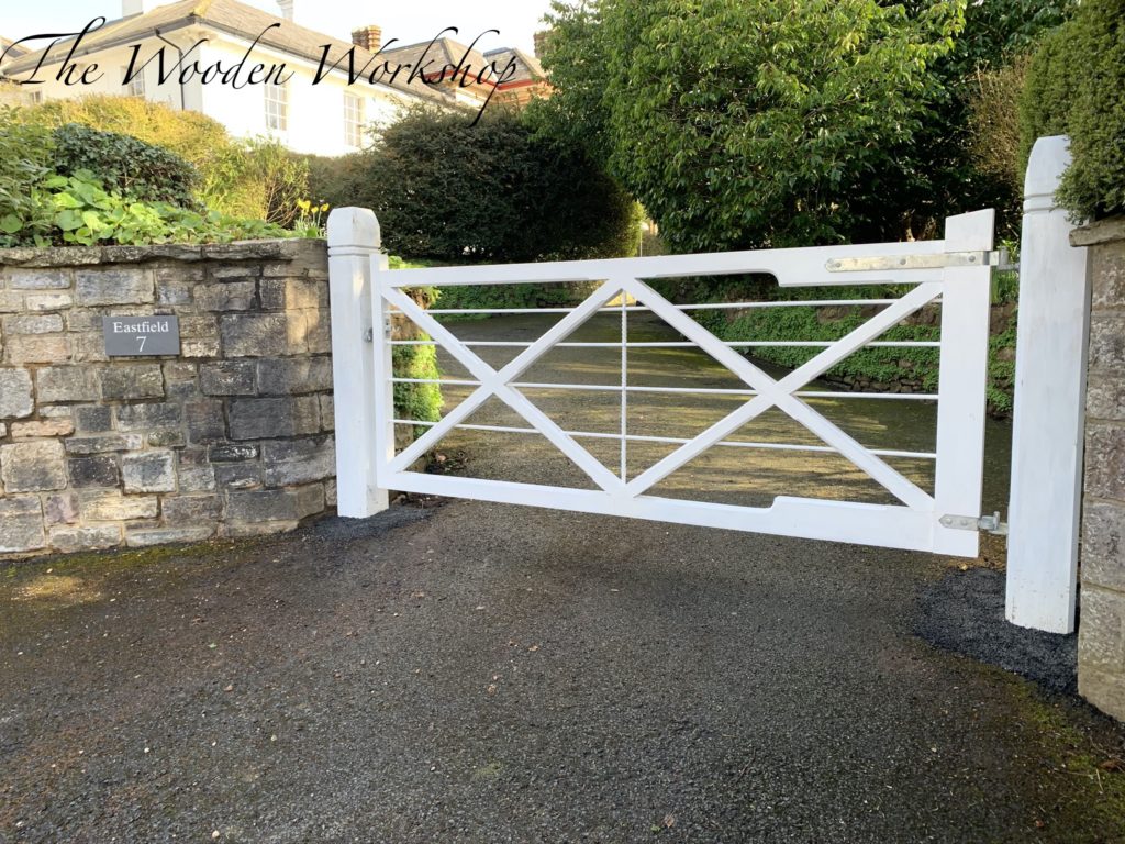 A pair of Sapele hardwood gates painted in white gloss paint