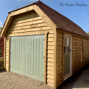 Timber garage with a hipped roof using cedar shingles - The Wooden Workshop Devon