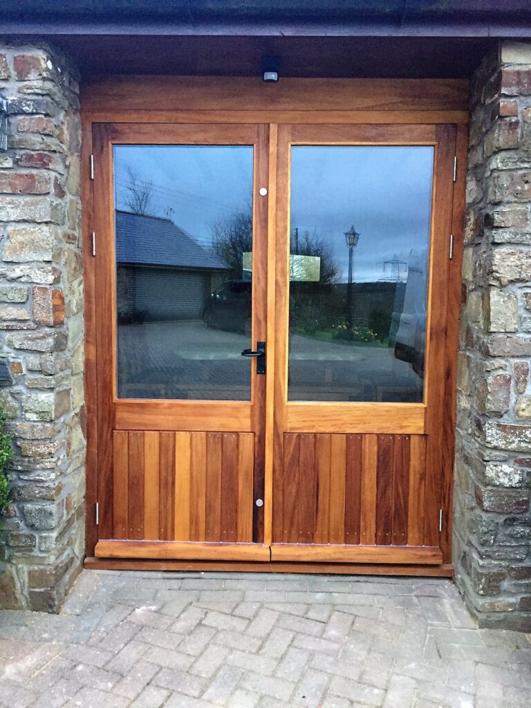 a pair of French doors fully glazed and constructed from Iron hardwood timber