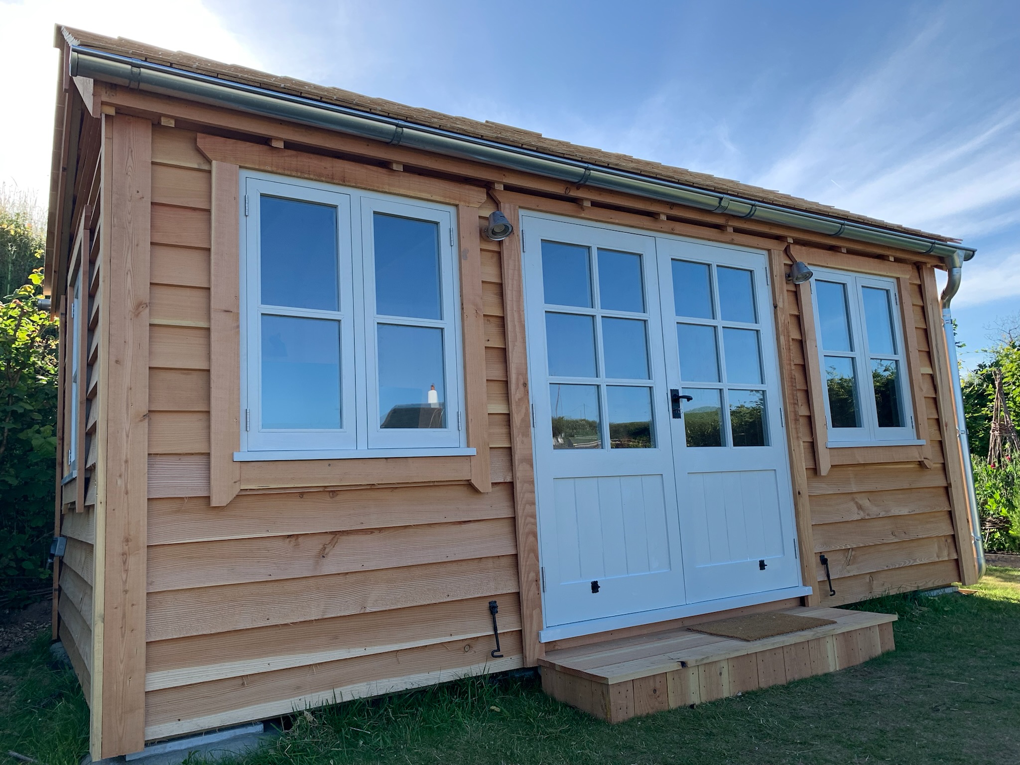 Timber garden Office With handmade doors and windows
